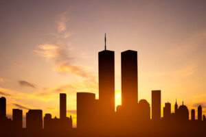 New York skyline silhouette with Towers against the sunset. Patriot Day banner. 9.11.2001
