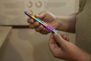 Woman shops for Cannabis vape pen at dispensary